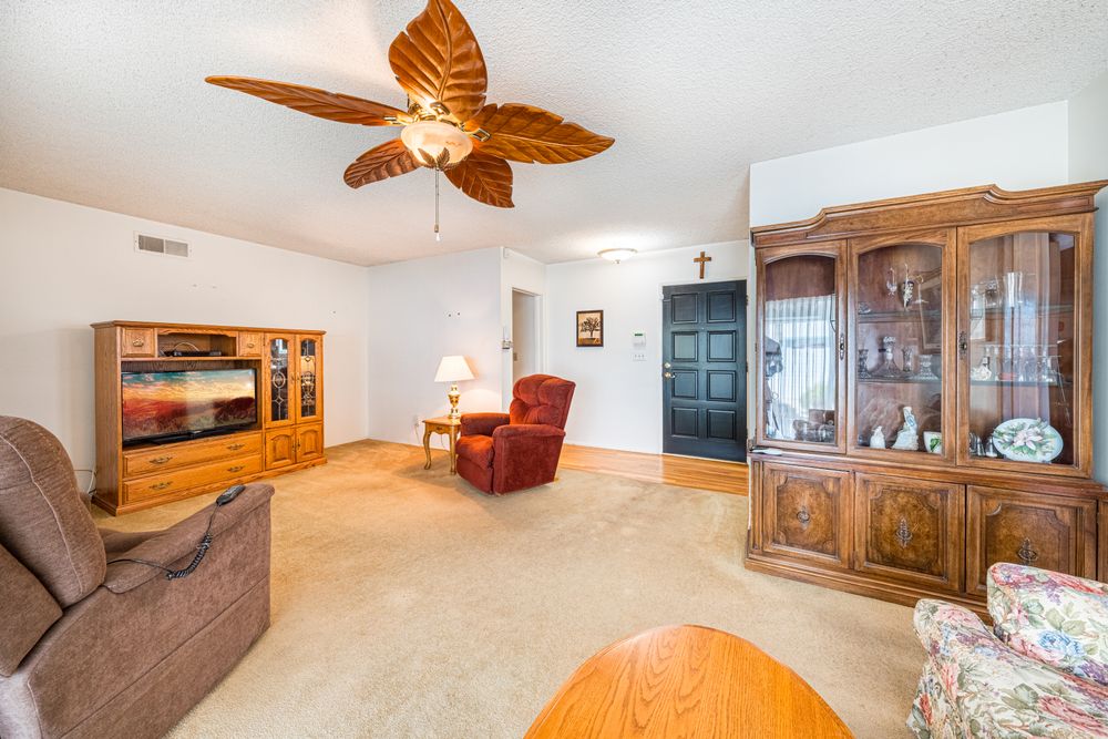 Residential ceiling fan in a warm furnished living room
