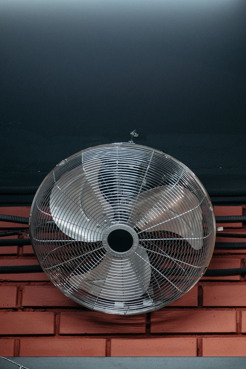 Ceiling fan viewed from below in a comfortable home interior