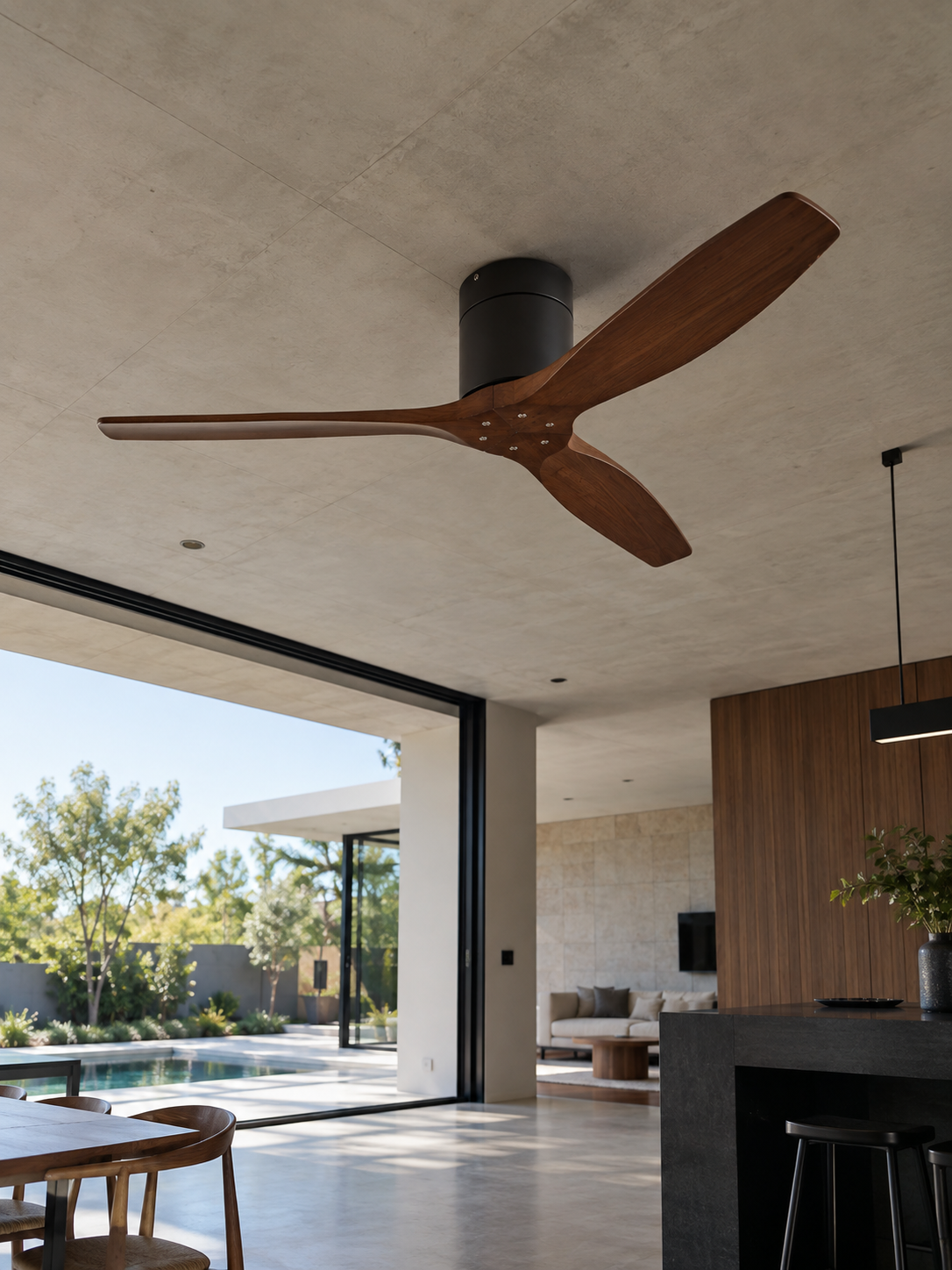 Solid wood ceiling fan in a modern open-plan kitchen and living space